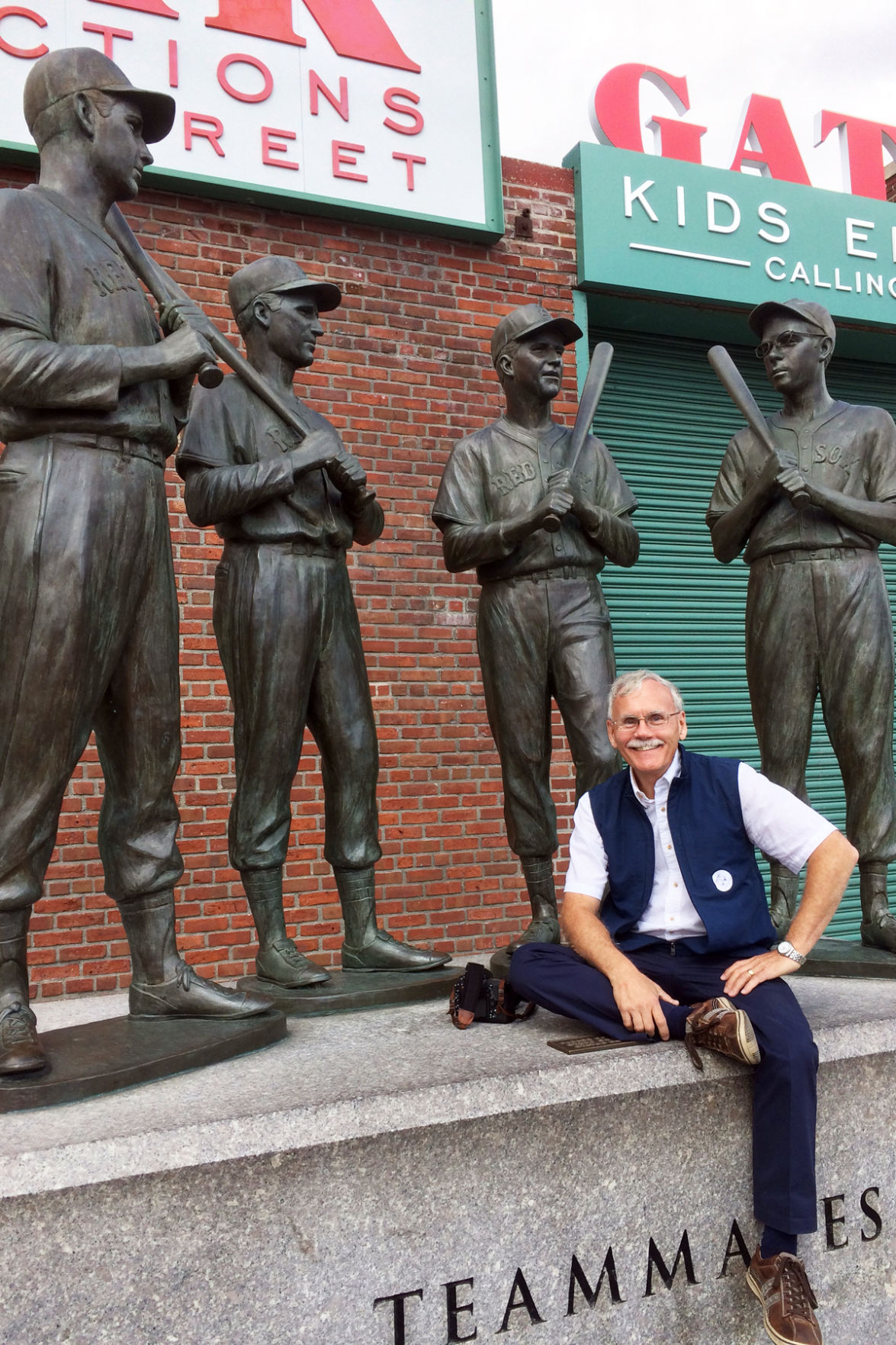 171 Dave Mettenbrink posed with the Teammates statue at Fenway Park.jpg